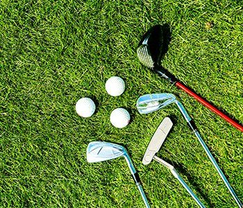 Custom Clubs — Golf Clubs and Balls on Grass in Bethlehem, PA Custom Clubs — Golf Clubs and Balls on Grass in Bethlehem, PA