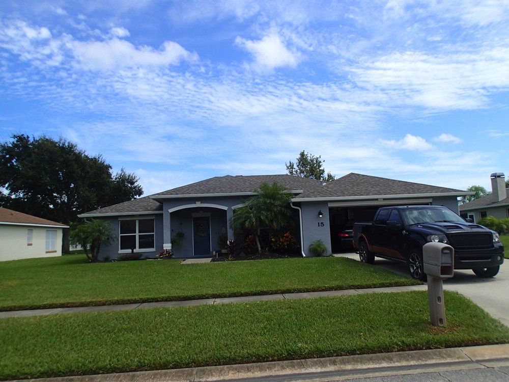Car in Front of House — South Daytona Beach, FL — Dal Mar Roofing Industries Inc