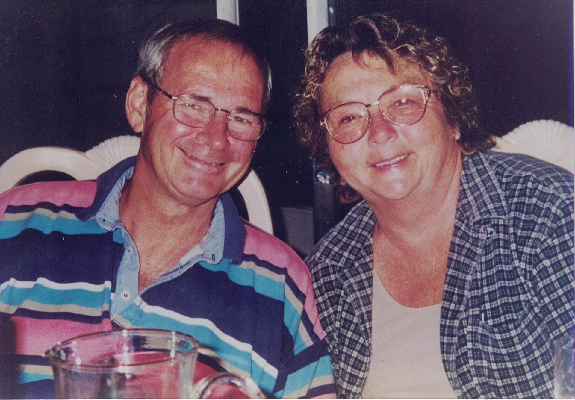 A man and a woman are posing for a picture together