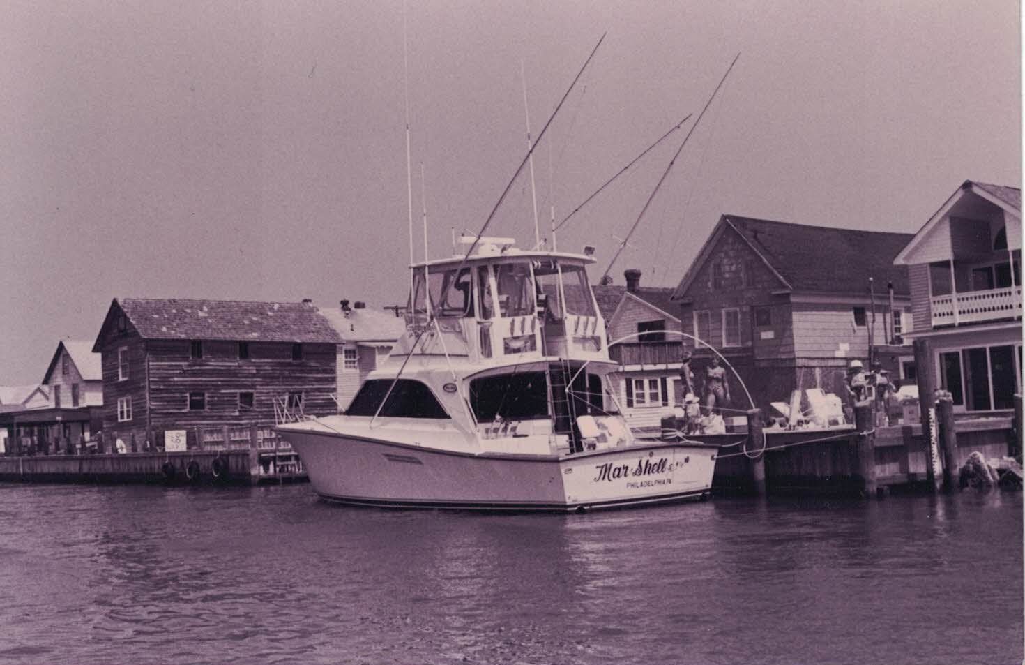 A black and white photo of a boat that says alaskan