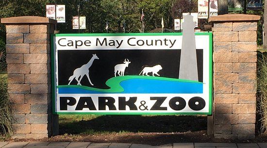 A sign for cape may county park and zoo