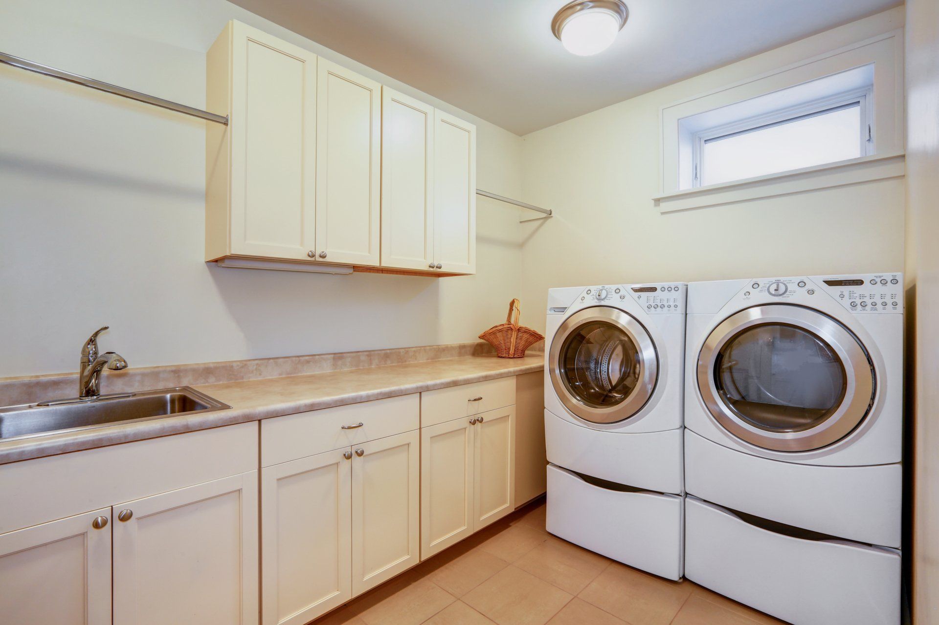 Light Laundry Room With Tons Of Storage — Absolute Bathrooms & Renovations in Lismore, NSW