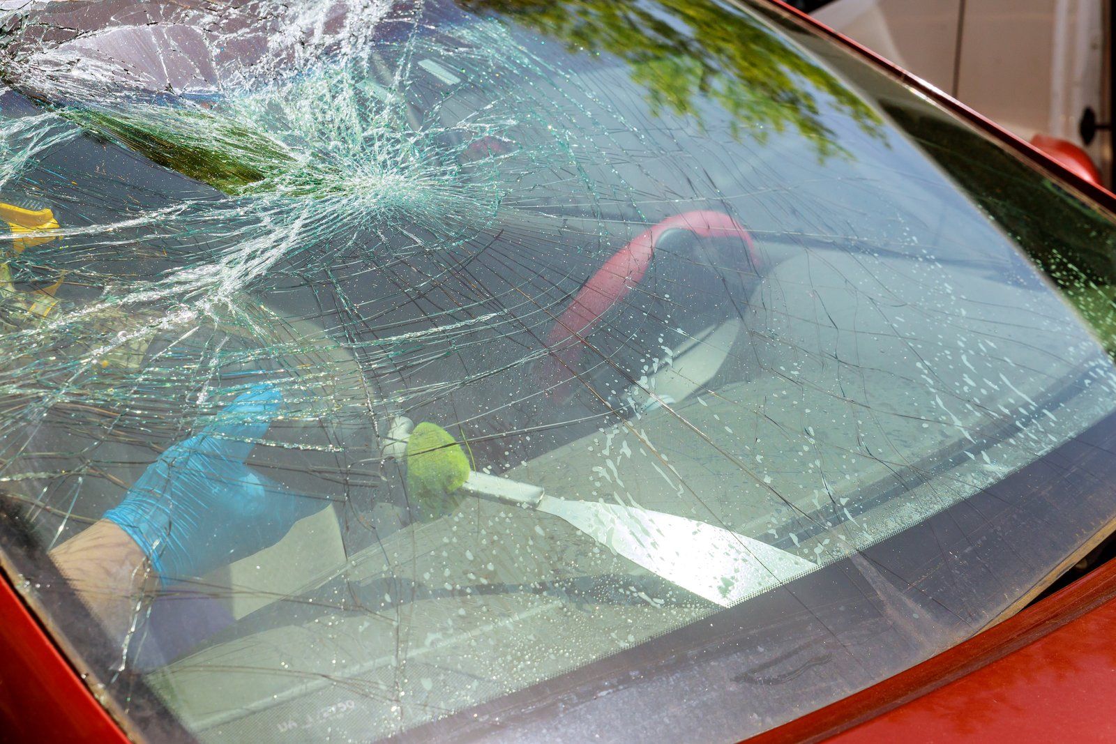 cracked red car windshield
