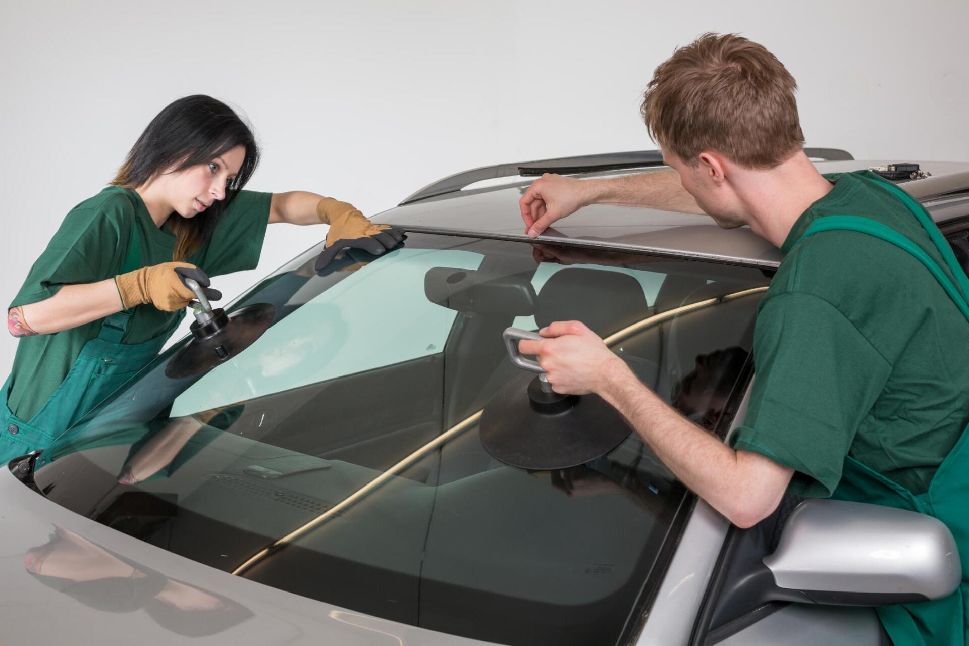 two people cleaning the windshield georgetown tx