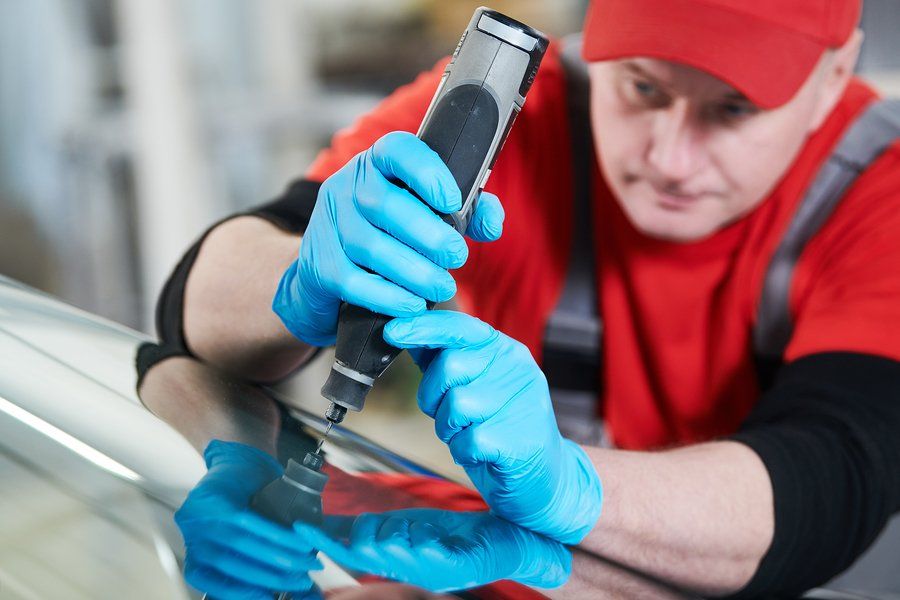 man using automotive driller