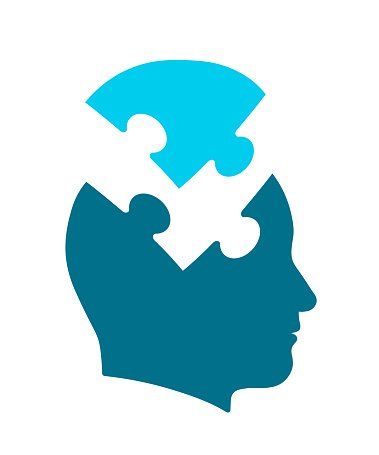Silhouette of a head with puzzle pieces forming the brain; blue and white.