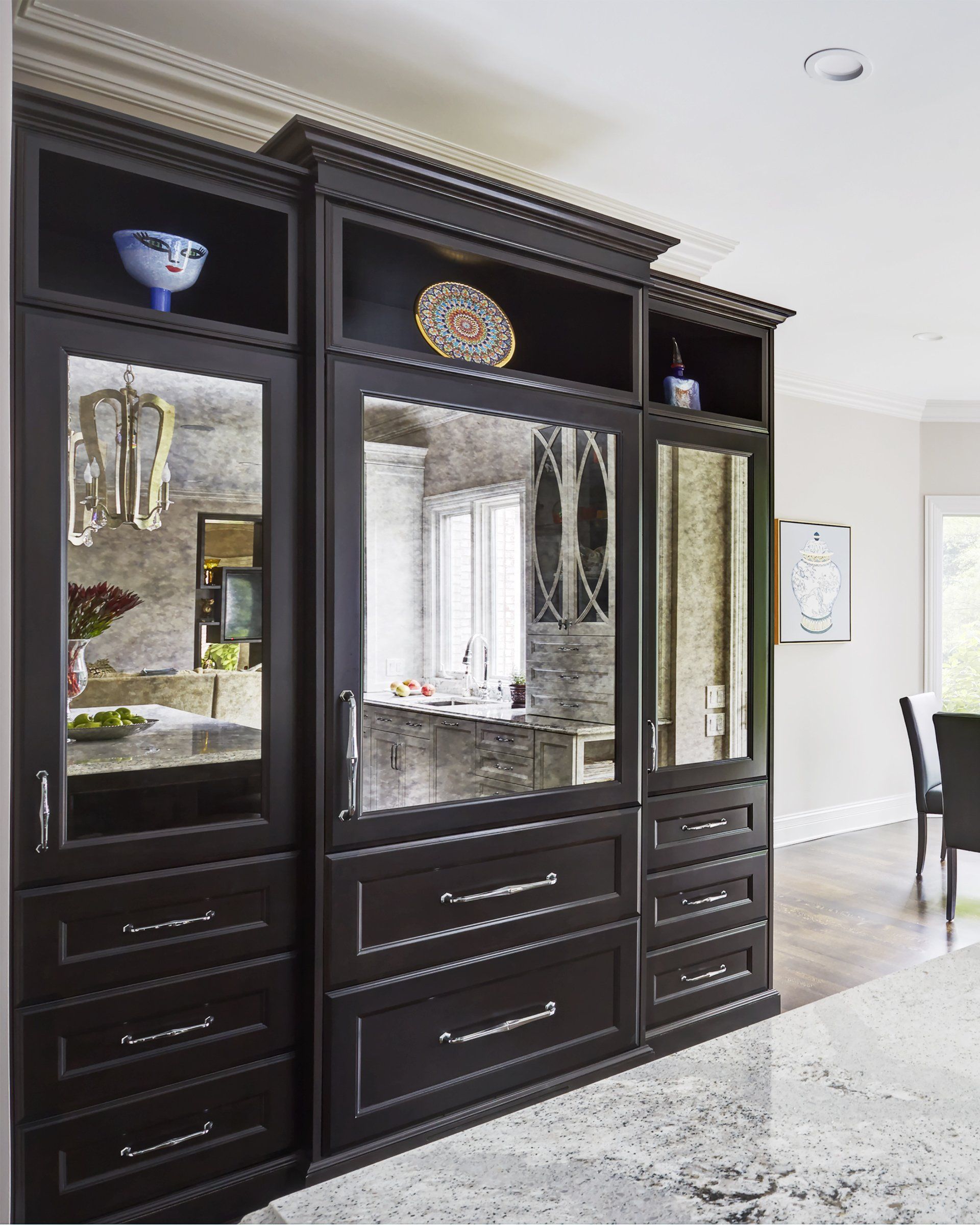 A kitchen with a lot of cabinets and drawers