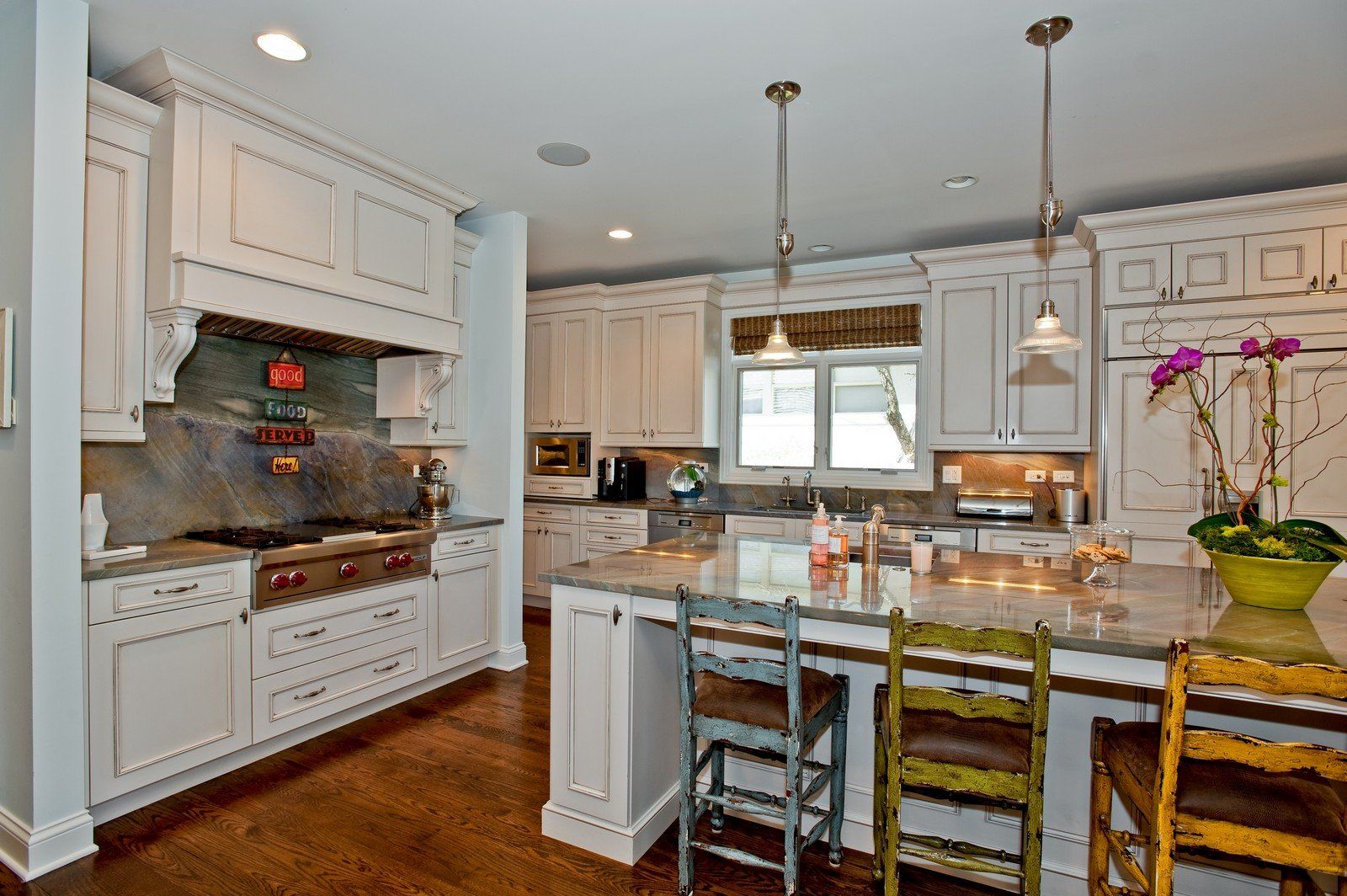 A kitchen with white cabinets and granite counter tops