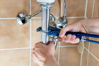 plumbing contractor working on bathroom remodel