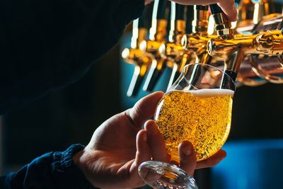 Bartender Pouring Draft Beer In Glass — Carlisle, PA — Stan’s Beverage Distributor Bartender Pouring Draft Beer In Glass — Carlisle, PA — Stan’s Beverage Distributor