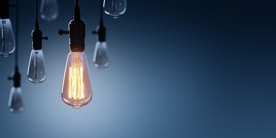 Innovation And Leadership Concept - Glowing Bulb lamp