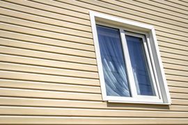 Vinyl Siding — Beige Siding with Window in Clayton, NC