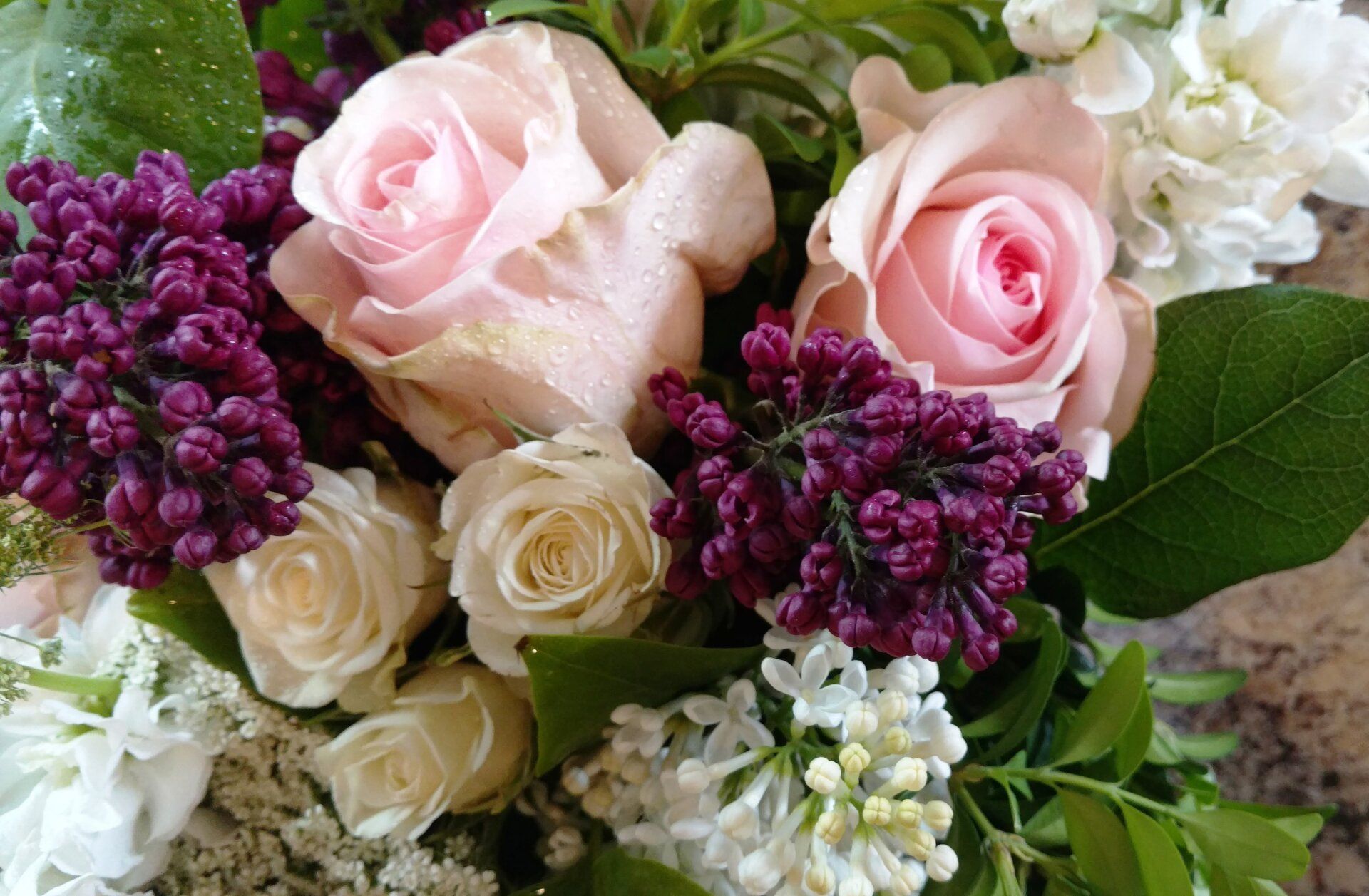 there are many different types of flowers in this bouquet .