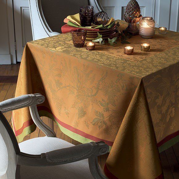 a table with a table cloth and candles on it