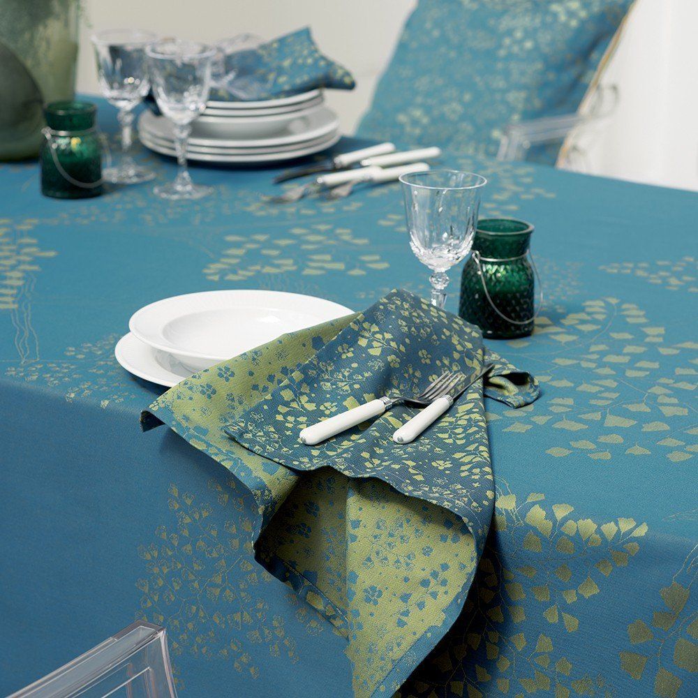 a table with plates glasses and candles on it