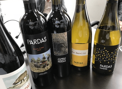 a group of wine bottles are sitting on a table .