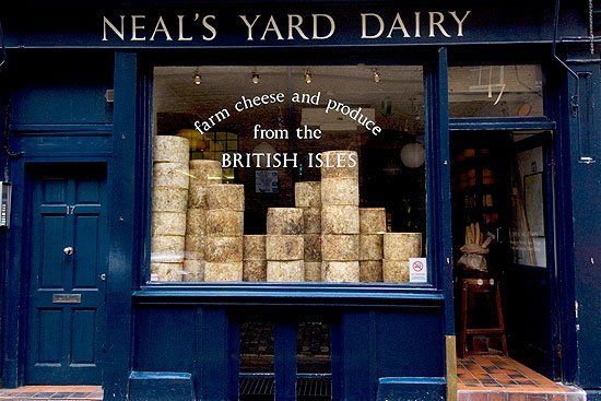 a blue building with a sign that says neal 's yard dairy