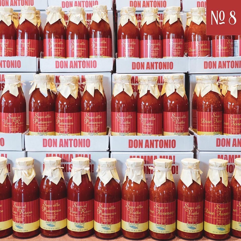 many bottles of don antonio are lined up in rows