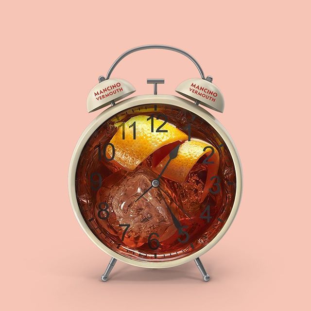 an alarm clock with a martini inside of it