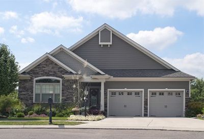 Contractor Work — Front View of a Suburban House with Two-Car Garage in Louisiana Contractor Work — Front View of a Suburban House with Two-Car Garage in Louisiana