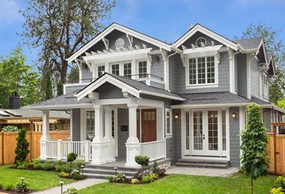 Real Estate — Beautiful Luxury Home Exterior with Green Grass and Landscaped Yard in Louisiana Real Estate — Beautiful Luxury Home Exterior with Green Grass and Landscaped Yard in Louisiana