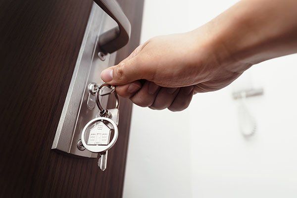 unlocking door with keys