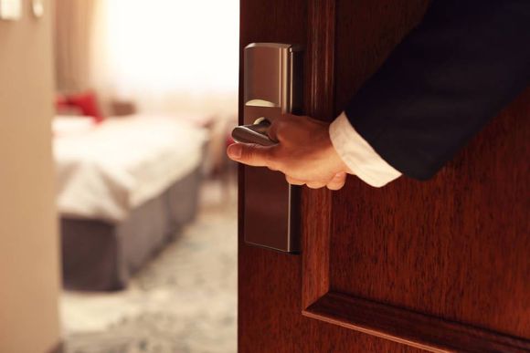 man opening the bedroom door