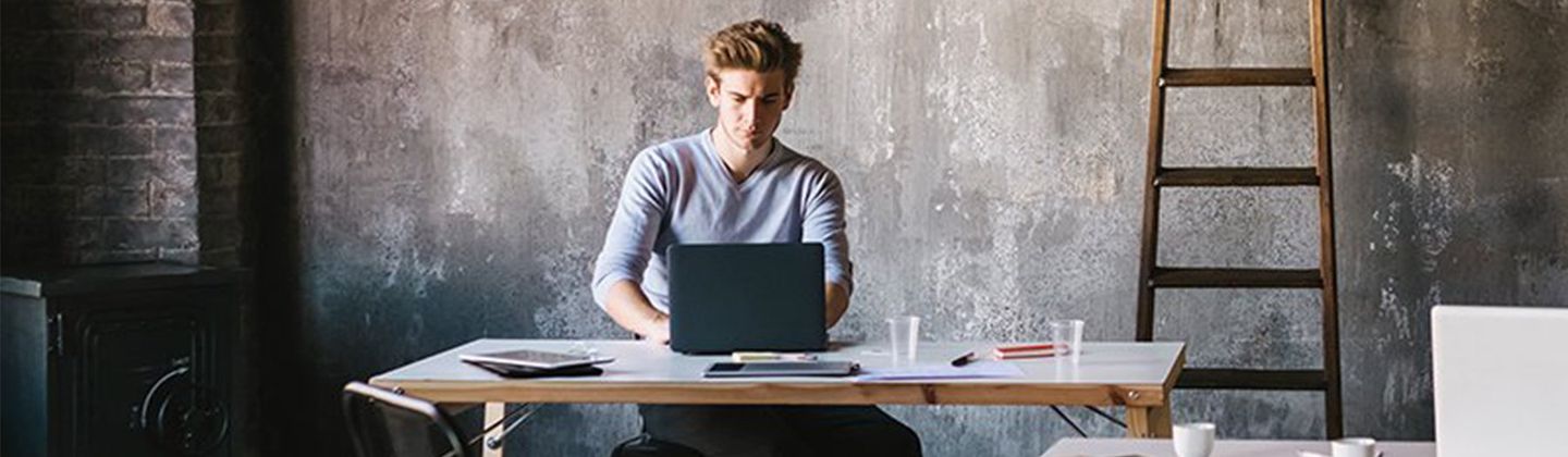 A student studies in his apartment