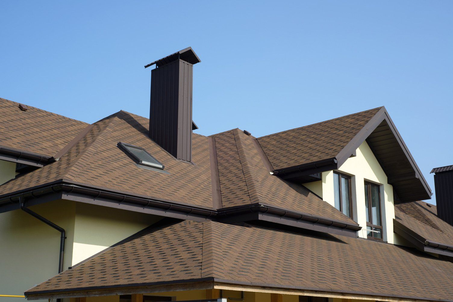 A set of clean asphalt sheet roof, freshly painted in brown. Done by local roofing contractors in Hobart, TAS.