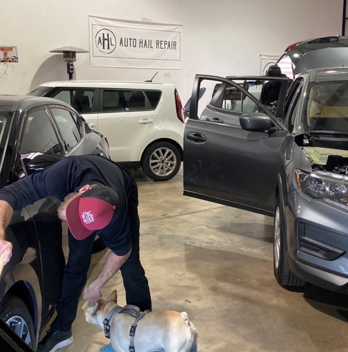 Workers Examining Vehicle Body for Scratches — Edmond, OK — Auto Hail Logistics
