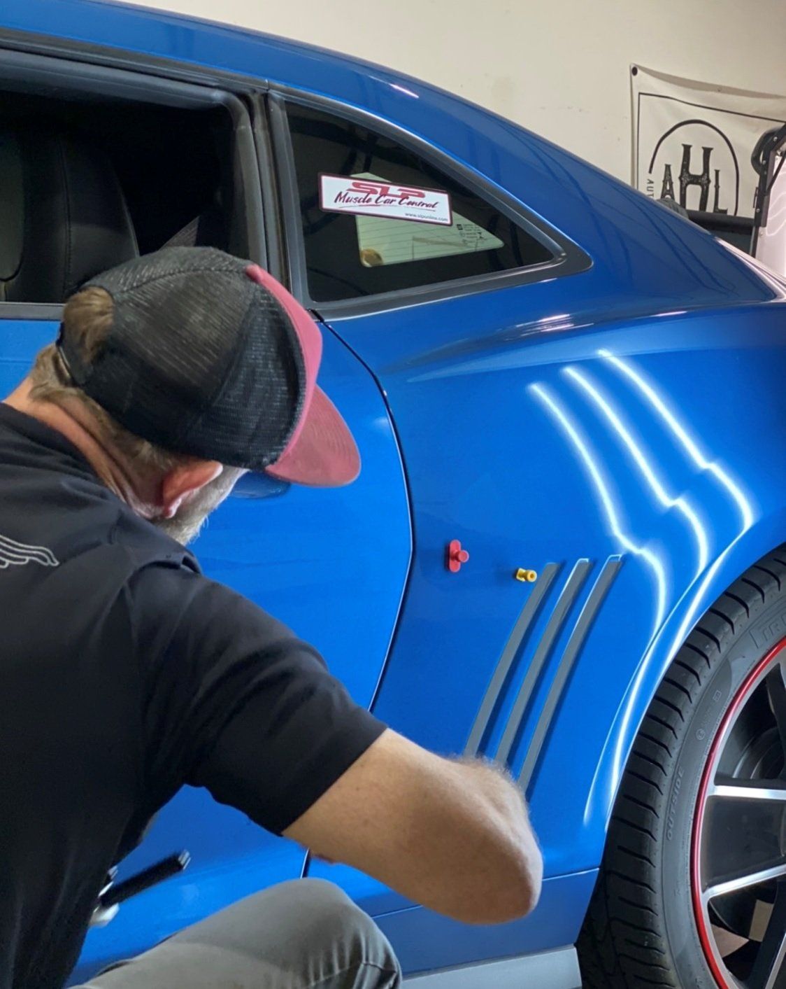 Man Checking Car Dent — Edmond, OK — Auto Hail Logistics