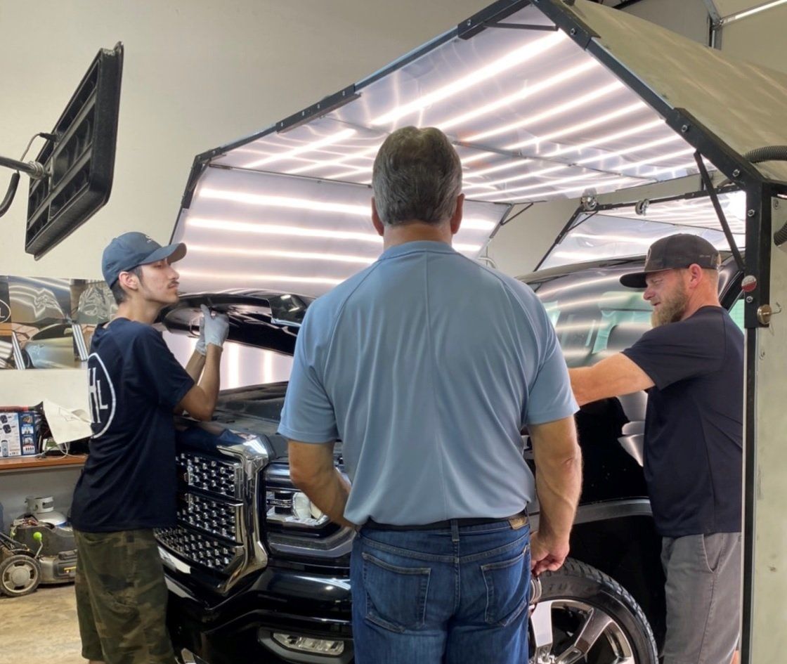 Examining Car — Edmond, OK — Auto Hail Logistics