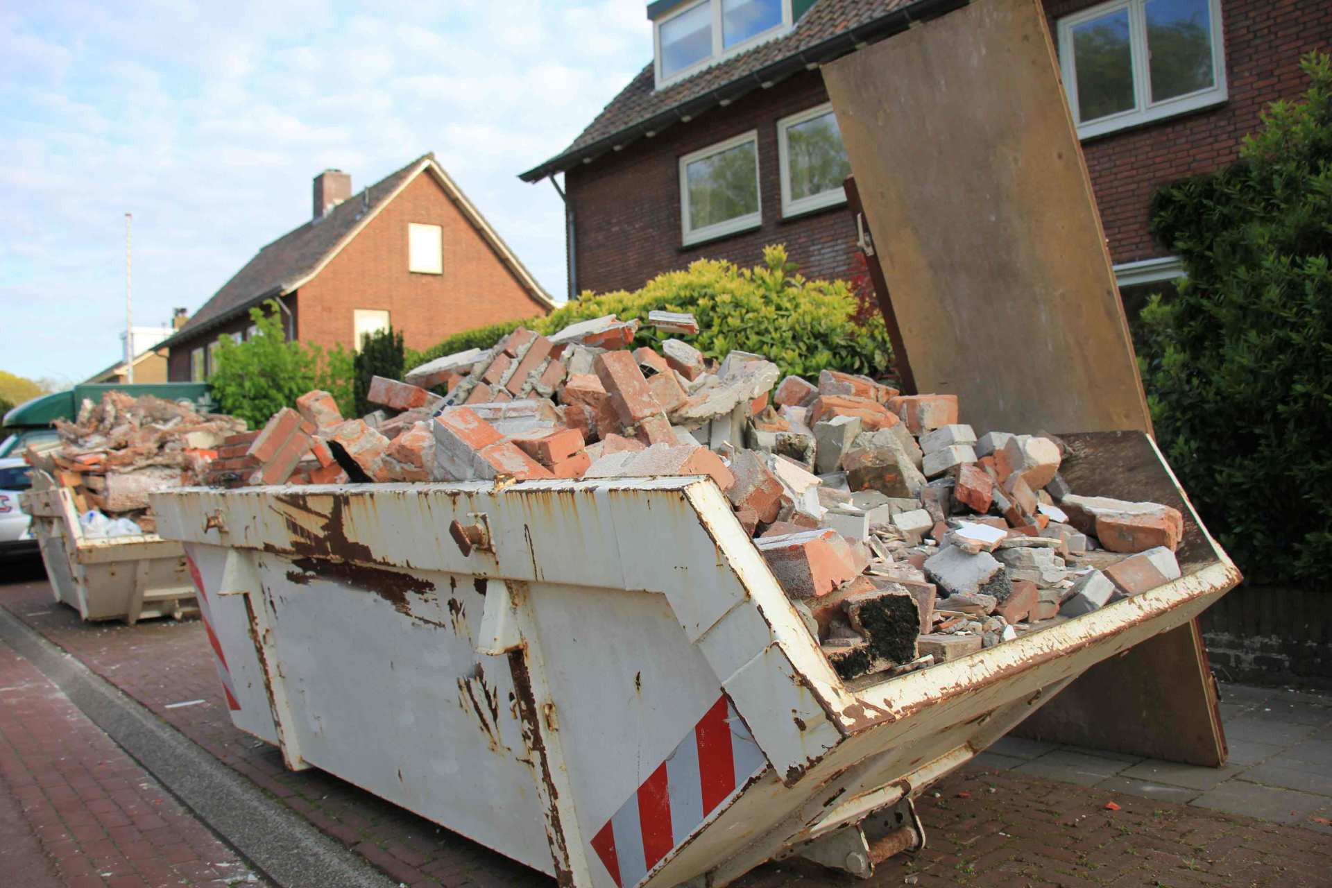 Loaded dumpster near a construction site, home renovation