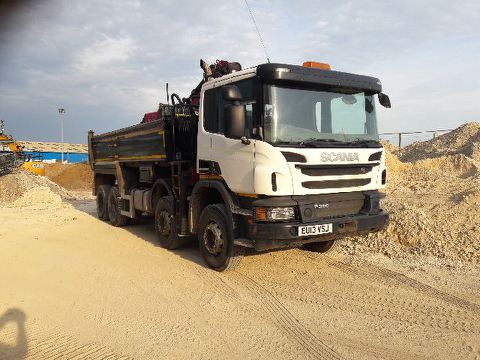 loaded skip lorry