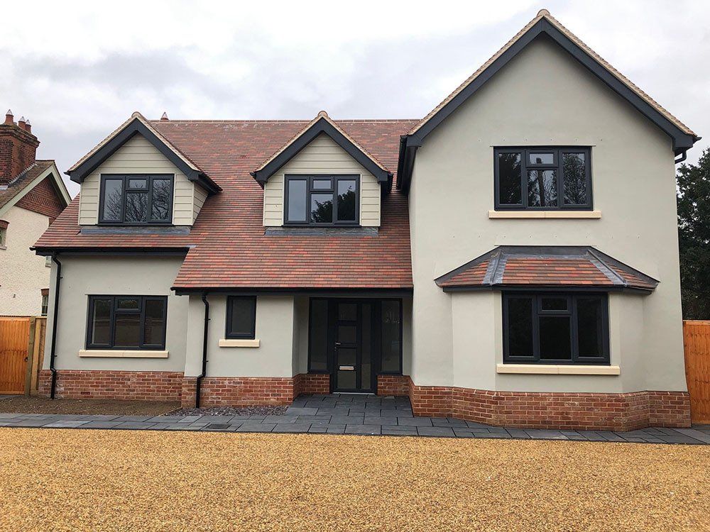 UPVC wood grained effect windows with a Brett Suffolk door and side screens – Halesworth, Suffolk