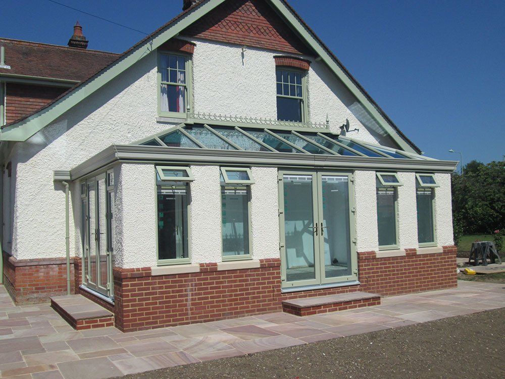UPVC double-hipped orangery in Chartwell Green with cornice guttering – Halesworth, Suffolk