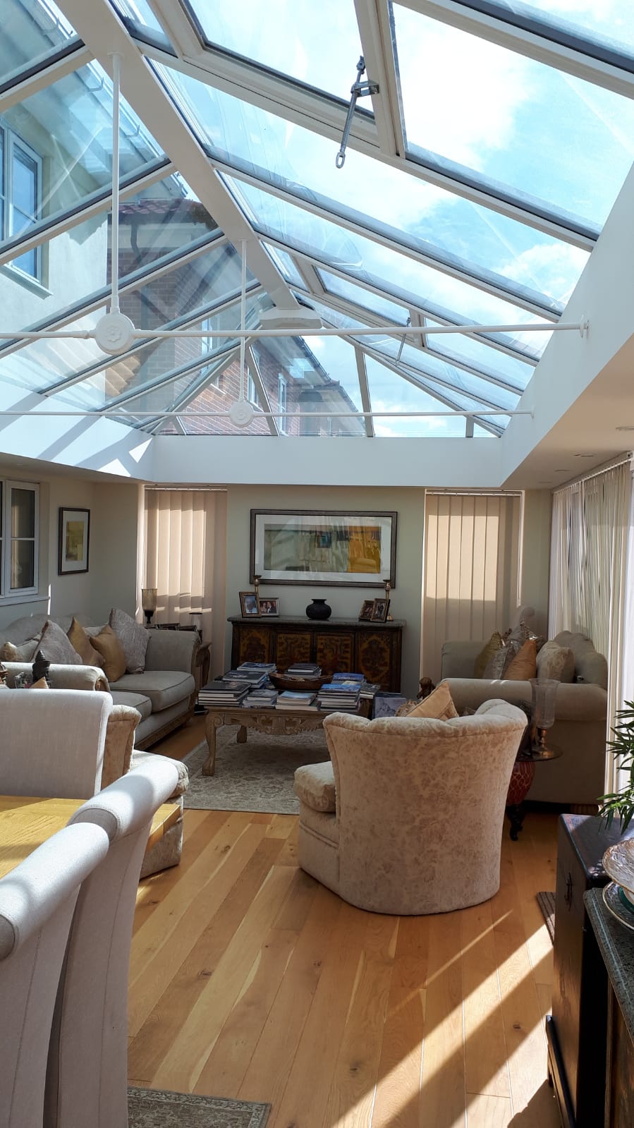 Internal view of UPVC double-hipped Edwardian fully glazed conservatory with Loggia corner posts, glass roof with vents and cornice guttering – Bury St Edmunds, Suffolk