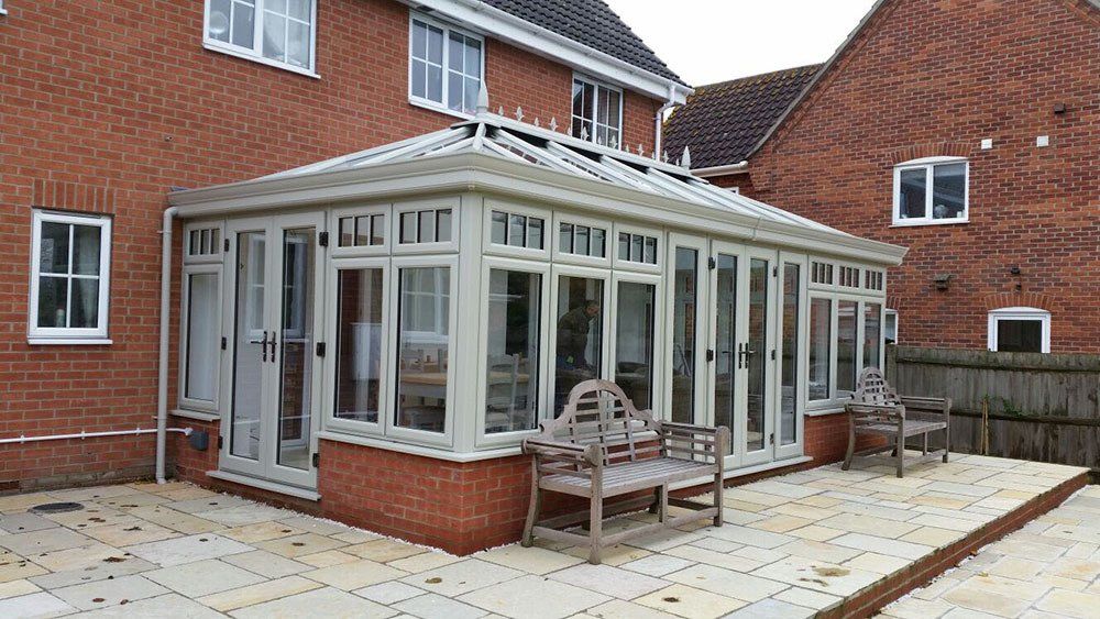 Double-hipped Edwardian conservatory in French Grey with cornice guttering – Diss, Norfolk