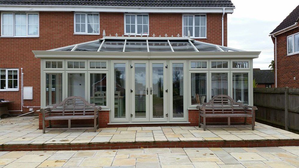 Double-hipped Edwardian conservatory in French Grey with cornice guttering – Diss, Norfolk