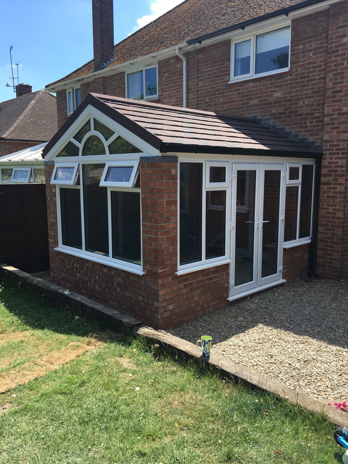 UPVC gable fronted conservatory with brick pillars ad dwarf wall, Guardian Warm Roof and Metrolite tiles – Halesworth, Suffolk