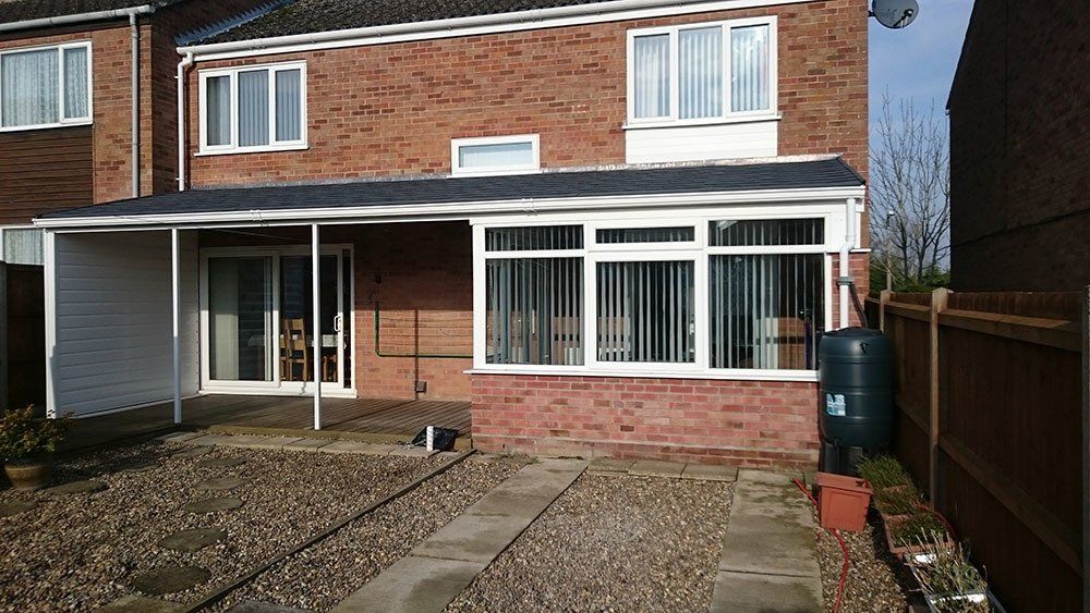 UPVC lean-to conservatory with extended Guardian Warm Roof with Metrolite tiles – Halesworth, Suffolk