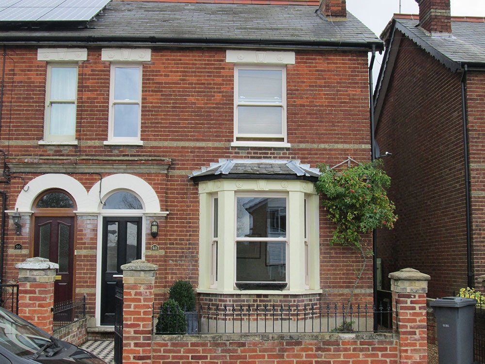 Sliding sash windows and composite door with shaped top light – Saxmundham, Suffolk