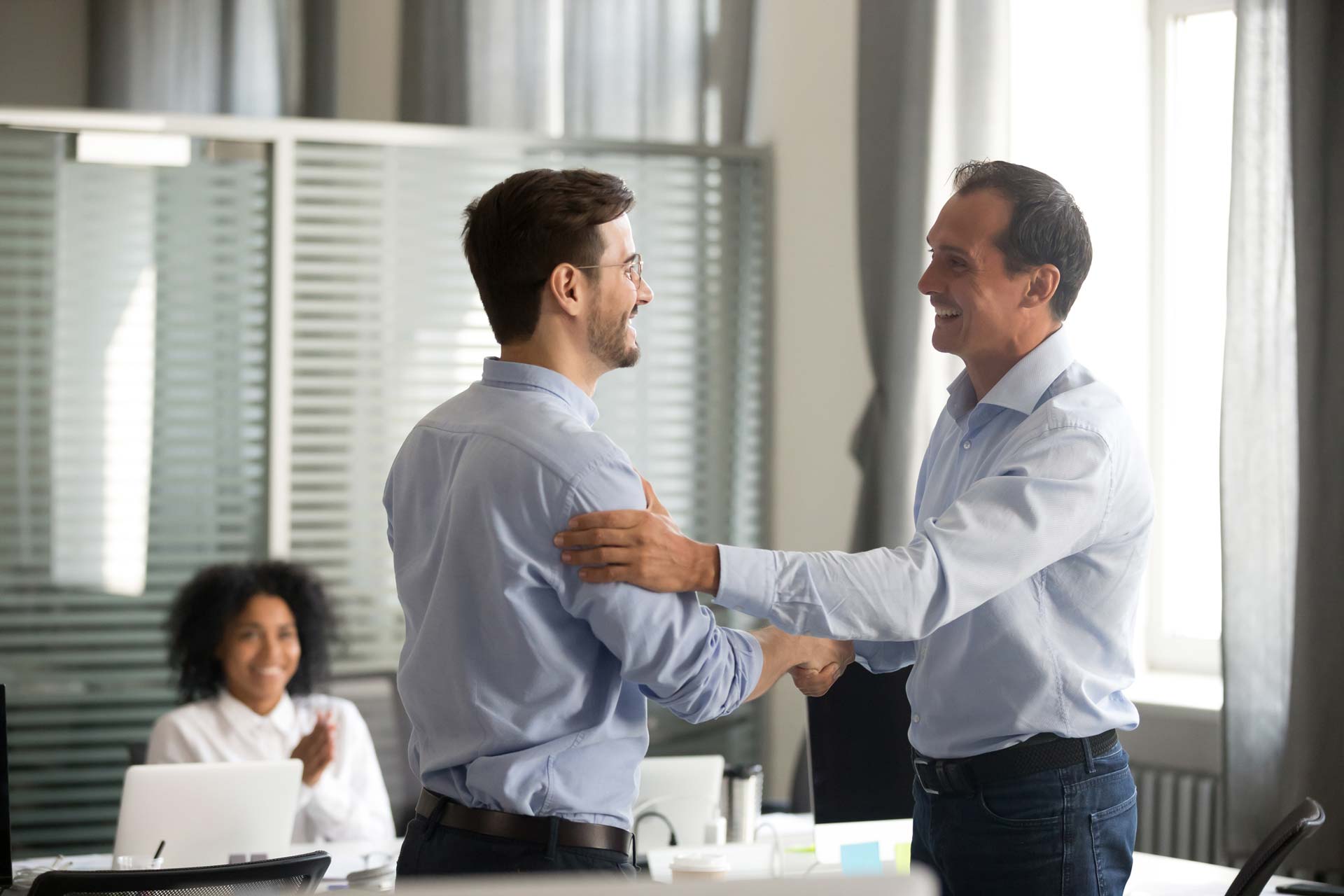 Happy Workers — Pawleys Island, SC — Weathers Law Firm LLC A man meeting a workers compensation lawyer near Georgetown, SC