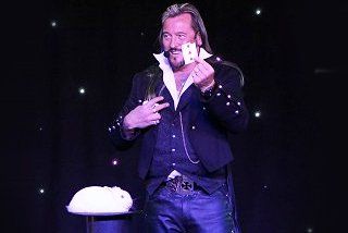 magician playing with cards