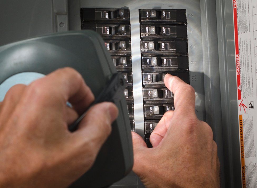 Man Inspecting Breaker Box — Crossett, AR — Master Technicians & Mechanicals LLC