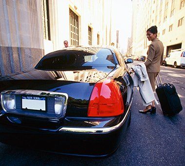 Woman Getting Inside the Car — Miramar, FL — A Regal Transportation Services Woman Getting Inside the Car — Miramar, FL — A Regal Transportation Services