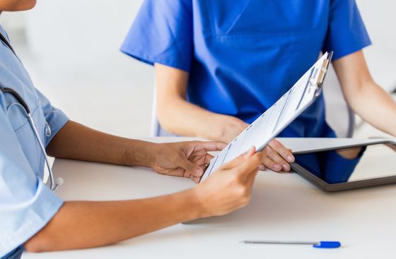 Doctor holding clipboard
