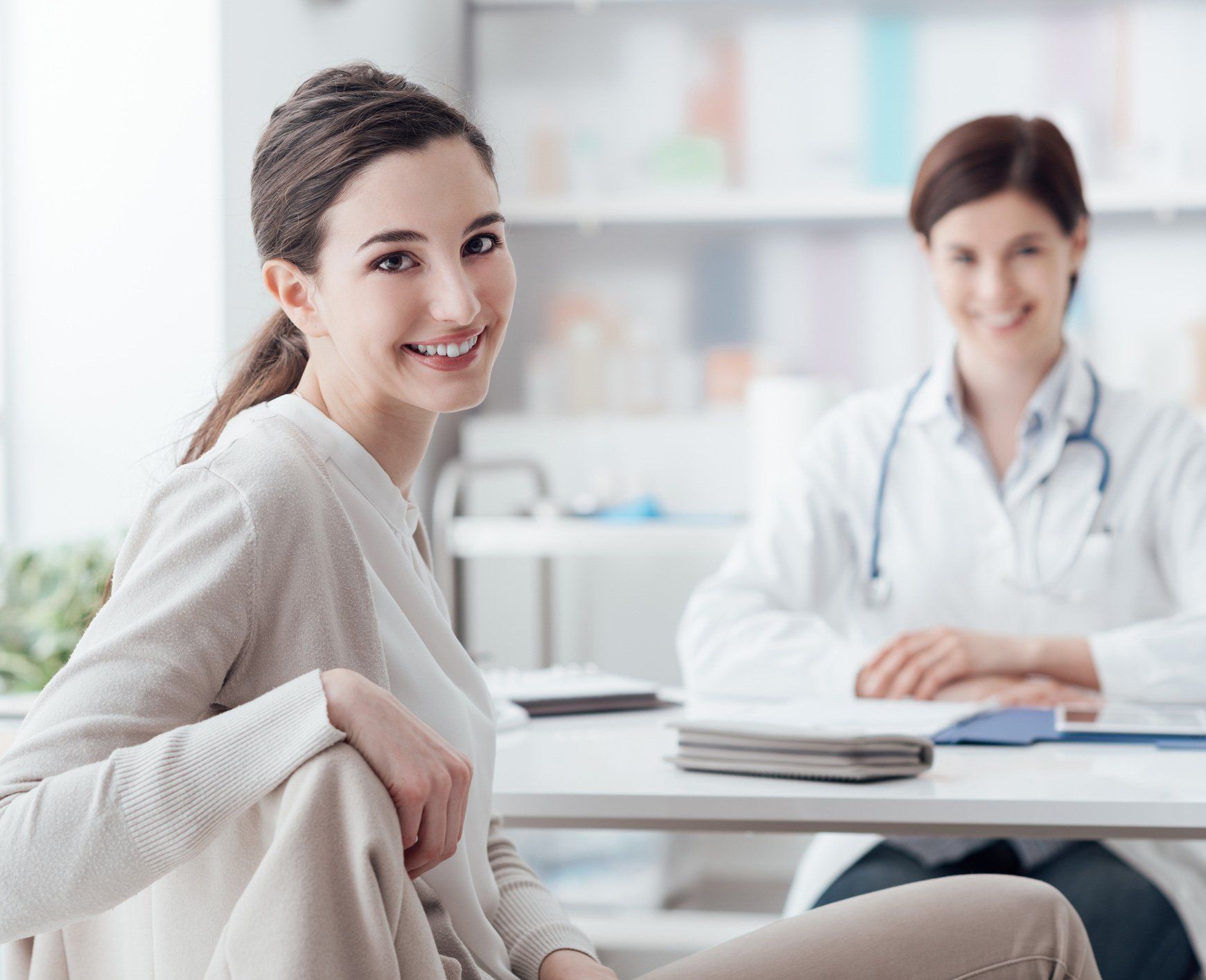 Woman and Doctor Smiling — Friendswood, TX — Gengler Insurance Woman and Doctor Smiling — Friendswood, TX — Gengler Insurance