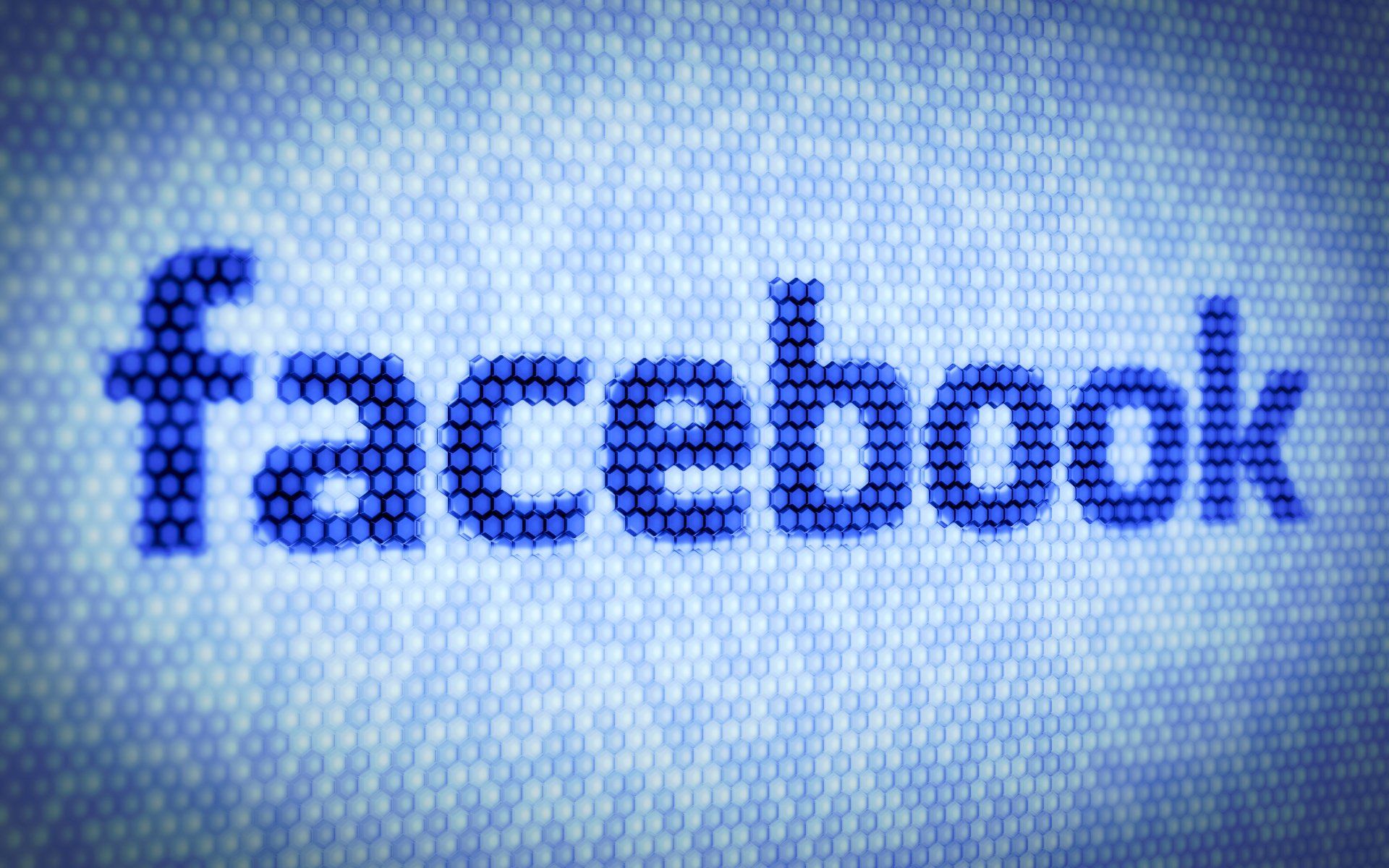 The word facebook is written in blue dots on a blue background