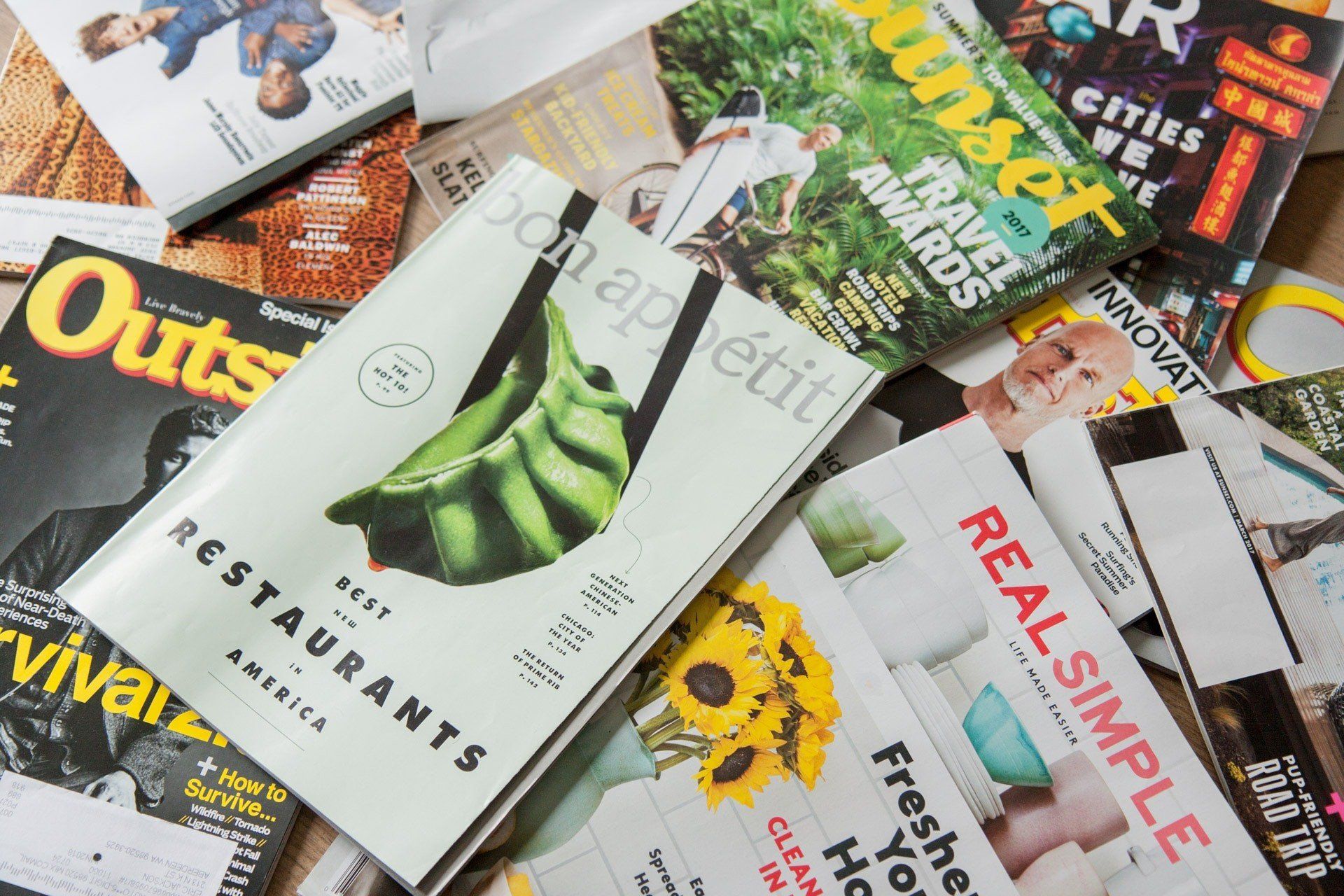 A pile of magazines including one that says real simple
